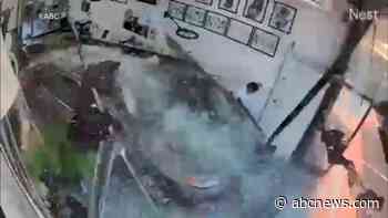 WATCH:  Car slams into tattoo shop