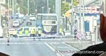 Police shut road and pavements amid ongoing incident