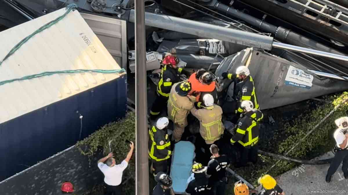 Worker rescued in drill rig collapse in Brickell hugs firefighter