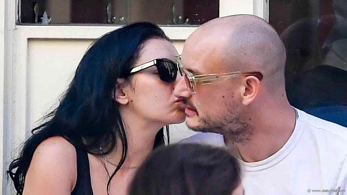 Charli XCX kisses her husband George Daniel in New York hours ahead of her gig in the city - after addressing backlash over her tour dates