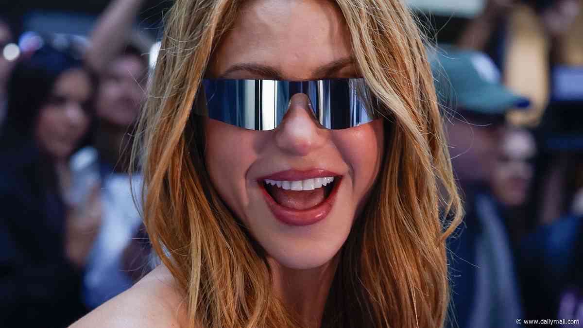 Shakira turns heads in a kooky Dior bustier as she arrives in Madrid - four months after winning a €55million tax refund from Spanish government