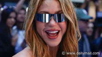 Shakira turns heads in a kooky Dior bustier as she arrives in Madrid - four months after winning a €55million tax refund from Spanish government
