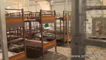 ‘Alligator Alcatraz’ put detainees in metal cages labeled ‘calming areas’