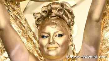 Hacks star Meg Stalter slammed as 'obnoxiously annoying' for dressing as an EMMY as she walks red carpet in bralette, wings and gold body paint