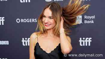 Lily James perfects her hair flick as she opts for low-key glamour in a classic LBD at the Toronto Film Festival premiere of Bad Lieutenant: Tokyo