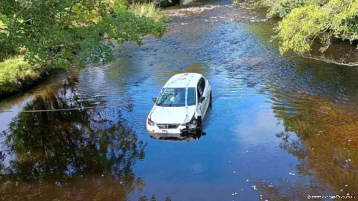 Two women 'trapped' on car roof with 'water rising' after bridge plunge