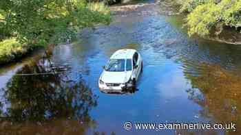 Two women 'trapped' on car roof with 'water rising' after bridge plunge