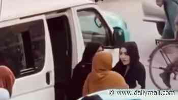 Moment Afghan woman fights back as female Taliban morality police try to force her into a van during brutal new crackdown in Kabul