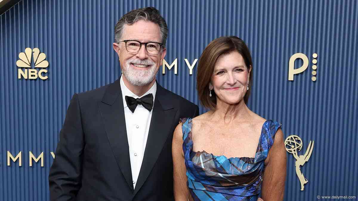 Stephen Colbert looks happier than ever as he poses with wife after Emmy win following a very 'tough' year