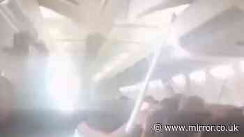 Plane passengers scream in horror as ceiling collapses on flight from hell