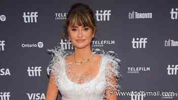 Penelope Cruz, 52, turns heads in a white feathered gown as she commands the red carpet at Toronto Film Festival premiere of La Bola Negra