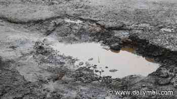 Forget ice and rain, now the sun causes potholes as well! RAC warns Britain's motorists could see surge in craters on the roads caused by hottest summer on record