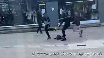 Mass brawl involving 15 people breaks out at Bury interchange with two arrested