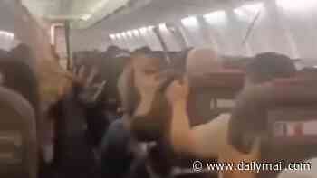 Moment Boeing 737's cabin roof collapses on to screaming passengers as tyre bursts and shuddering aircraft suffers engine damage in Iran