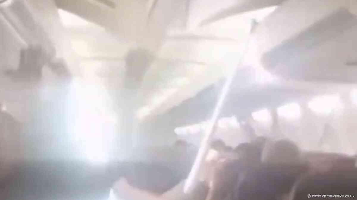 WATCH: Plane ceiling collapses as passengers scream during Iran emergency landing