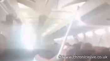 WATCH: Plane ceiling collapses as passengers scream during Iran emergency landing