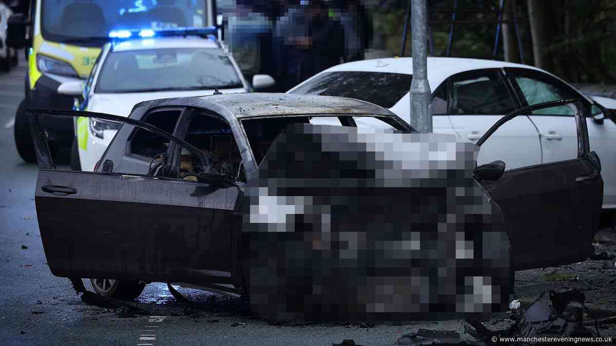 Man arrested as car bursts into flames in crash at busy Oldham junction