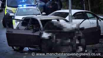 Man arrested as car bursts into flames in crash at busy Oldham junction