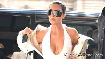 Kim Kardashian shows off her famous curves in a plunging white dress as she heads to work in Paris after romantic date night with Lewis Hamilton