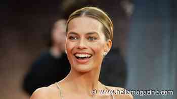 Margot Robbie is a retro bikini bombshell in new photos with ripped Bradley Cooper