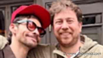 Busted's James Bourne, 43, beams in a rare sighting with Hilary Duff's husband Matthew Koma in London after 'life-extending' surgery