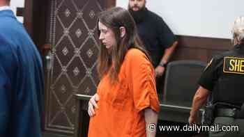 Ohio house of horrors mom-of-16 pleads not guilty to child abuse charges as she cradles stomach in court - but lawyer refuses to say if she's pregnant again