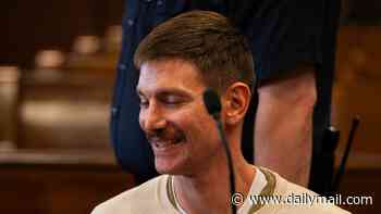 Grinning model showcases new facial hair as he stands accused of knifing his hunk husband to death in their NYC apartment