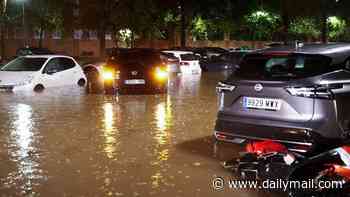 Streets are submerged by floods in Spain following country's hottest summer on record: Rescuers scramble to save woman washed away