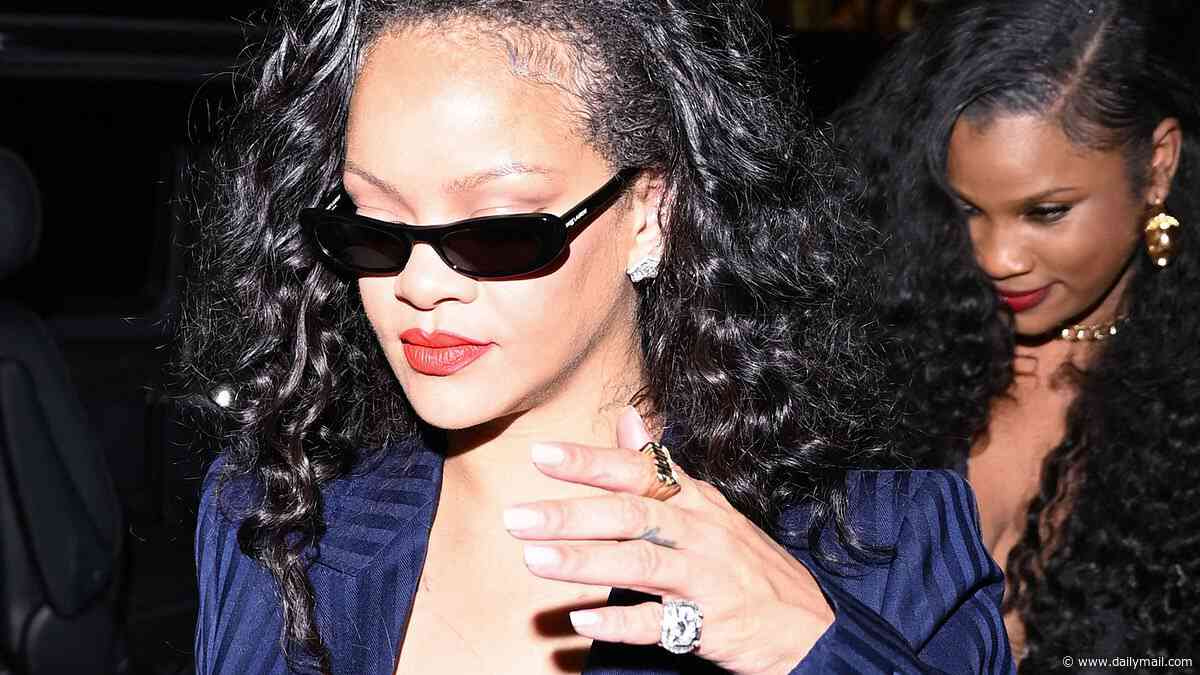 Rihanna flashes her lace bra in a plunging suit as she heads to dinner in Paris after Celine Dion's concert