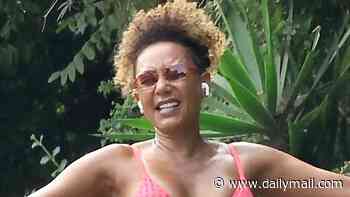 Bikini-clad Mel B, 51, puts some zig-a-zig-ah into her morning steps as she dances in the street on a morning hike with shirtless husband Rory McPhee, 38