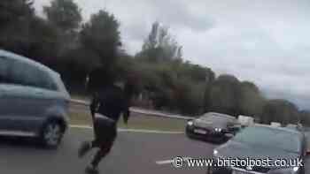 Crazy moment man runs onto A-road after dramatic police chase