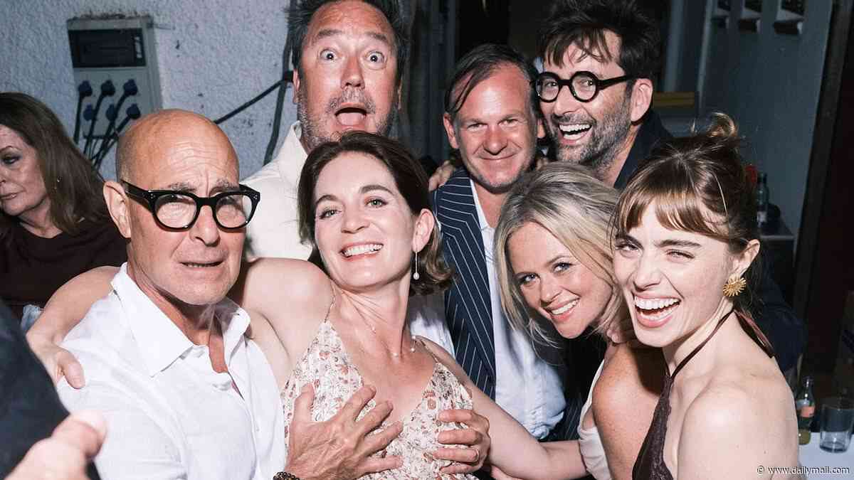 Inside Emily Atack's raucous wedding reception as Stanley Tucci cheekily paws at wife Felicity Blunt while fellow champagne-guzzling guests let loose on the dancefloor
