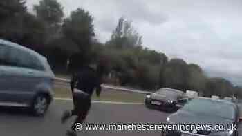Moment man drives on wrong side and towards oncoming traffic during chase