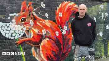 Artist unveils 525ft mural inspired by pupils
