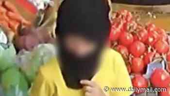 Moment balaclava-clad children as young as five steal from corner shop while their parents wait outside