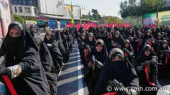 Iranians rally by the hundreds of thousands in biggest show of defiance since war began