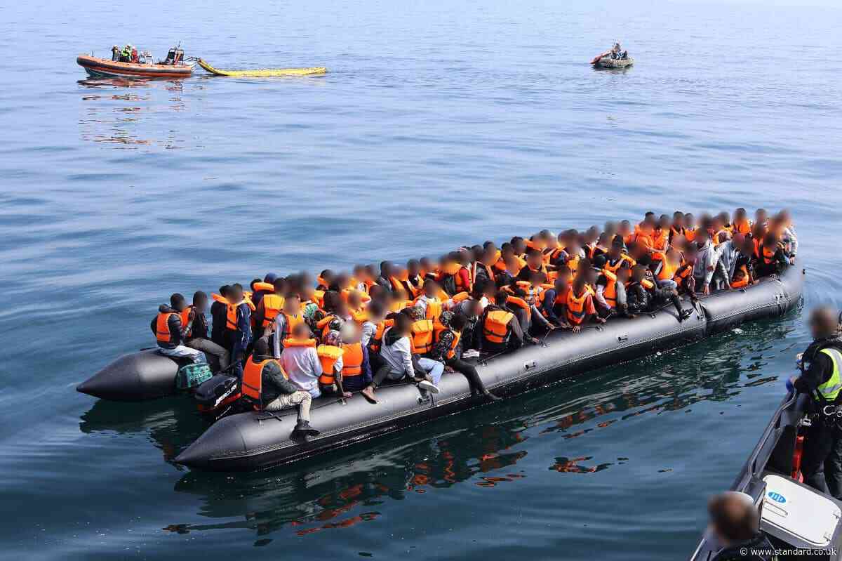 Footage captures teenager steering dinghy carrying 165 people across Channel