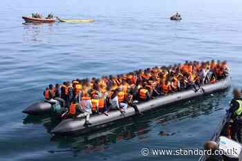 Footage captures teenager steering dinghy carrying 165 people across Channel
