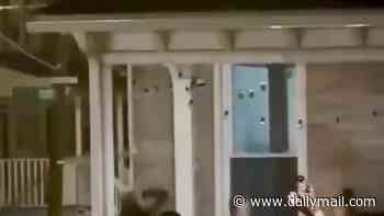 Vile clip shows up to TWELVE girls attacking college student and dragging her by hair after being asked to leave property