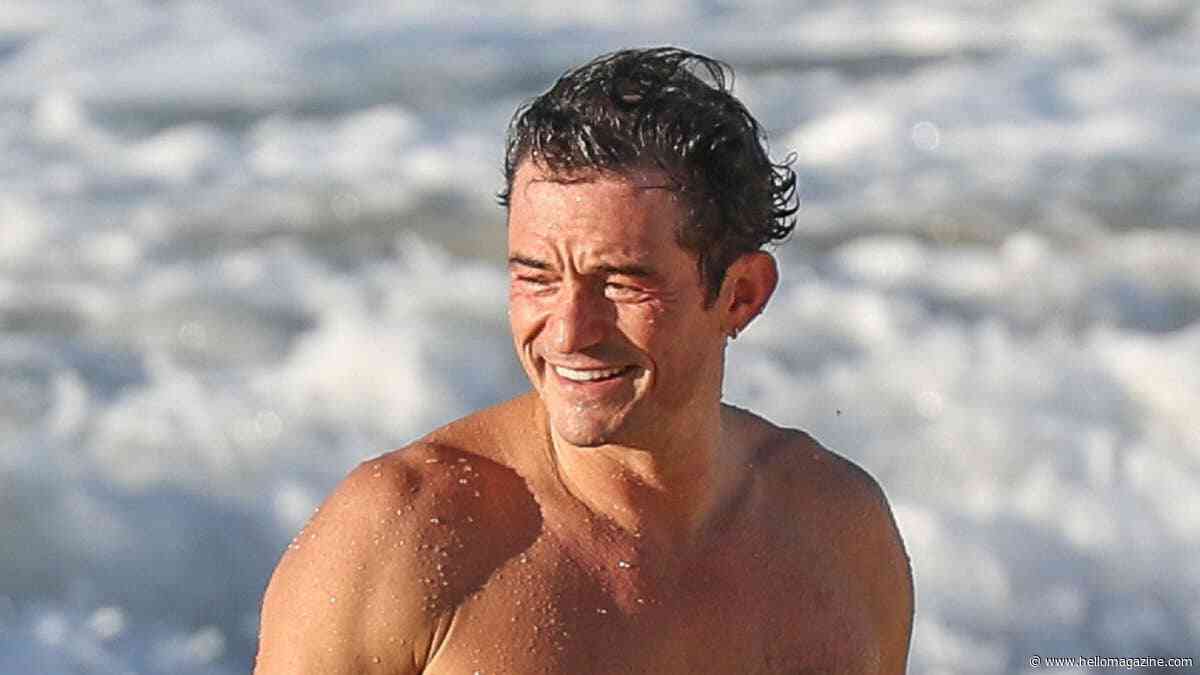 Shirtless Orlando Bloom is ripped in James Bond-worthy beach appearance