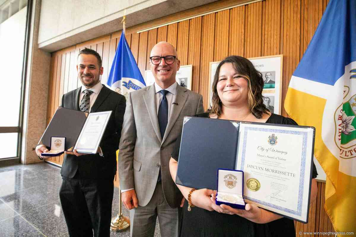 Mayor honours pair who rescued little girl, father from Red River in August