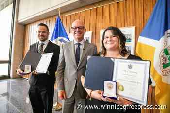 Mayor honours pair who rescued little girl, father from Red River in August