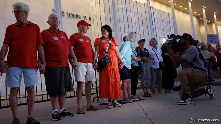 Protesters form human chain at Kennedy Center after Trump threatens demolition