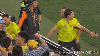 Umpires pelted with bottles leaving the field