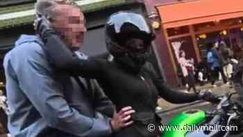 Moment 'inappropriate old man' jumps on primary school worker's motorbike and grabs her hips in front of his laughing pals