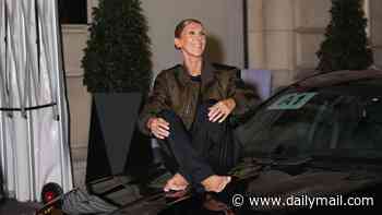 Celine Dion, 58, dances and sings barefoot on a car before bizarrely lying down on the bonnet outside her hotel after her show in Paris