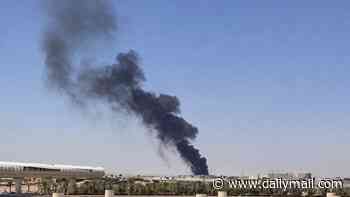 Smoke and flames billow over Riyadh airport in Saudi Arabia as Houthi rebels gain ground