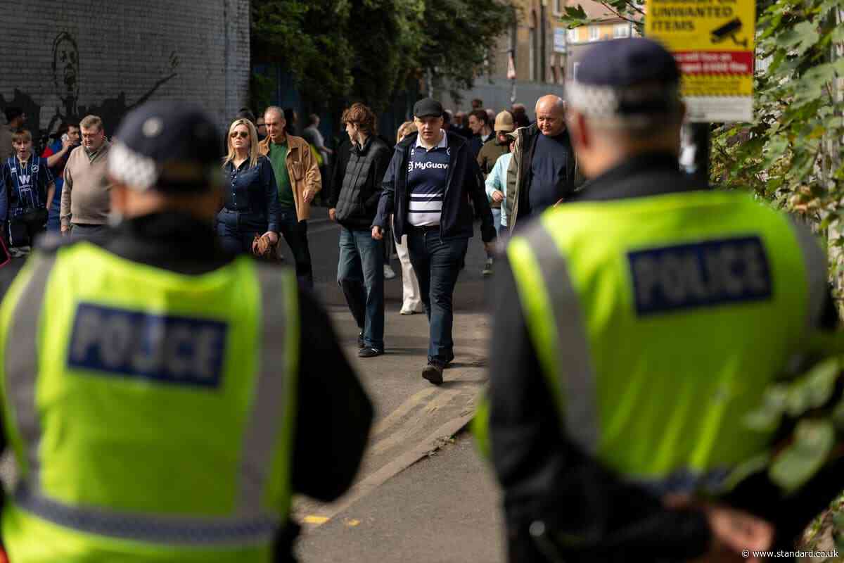 In pictures: Millwall and West Ham fans face police amid six arrests