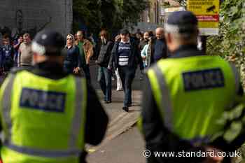 In pictures: Millwall and West Ham fans watch derby amid tight police presence