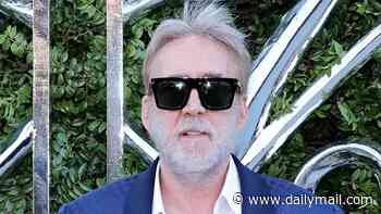 Nicolas Cage, 62, looks unrecognizable with full gray hair and beard as he makes rare red carpet appearance with much-younger wife